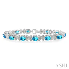 1/10 ctw Round Cut Diamond & 7x5MM Oval Cut Blue Topaz Semi Precious Bracelet in Silver