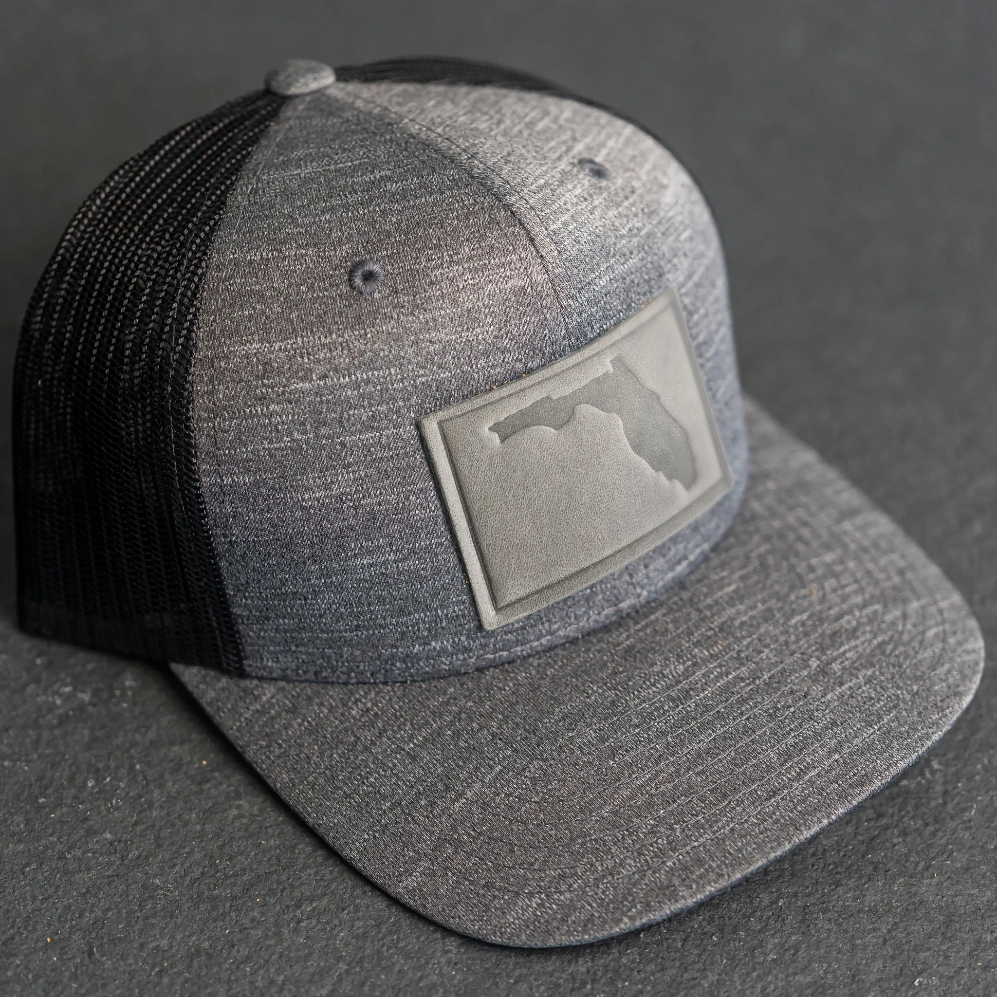 Leather Patch Performance Style Trucker Hat - Florida Stamp