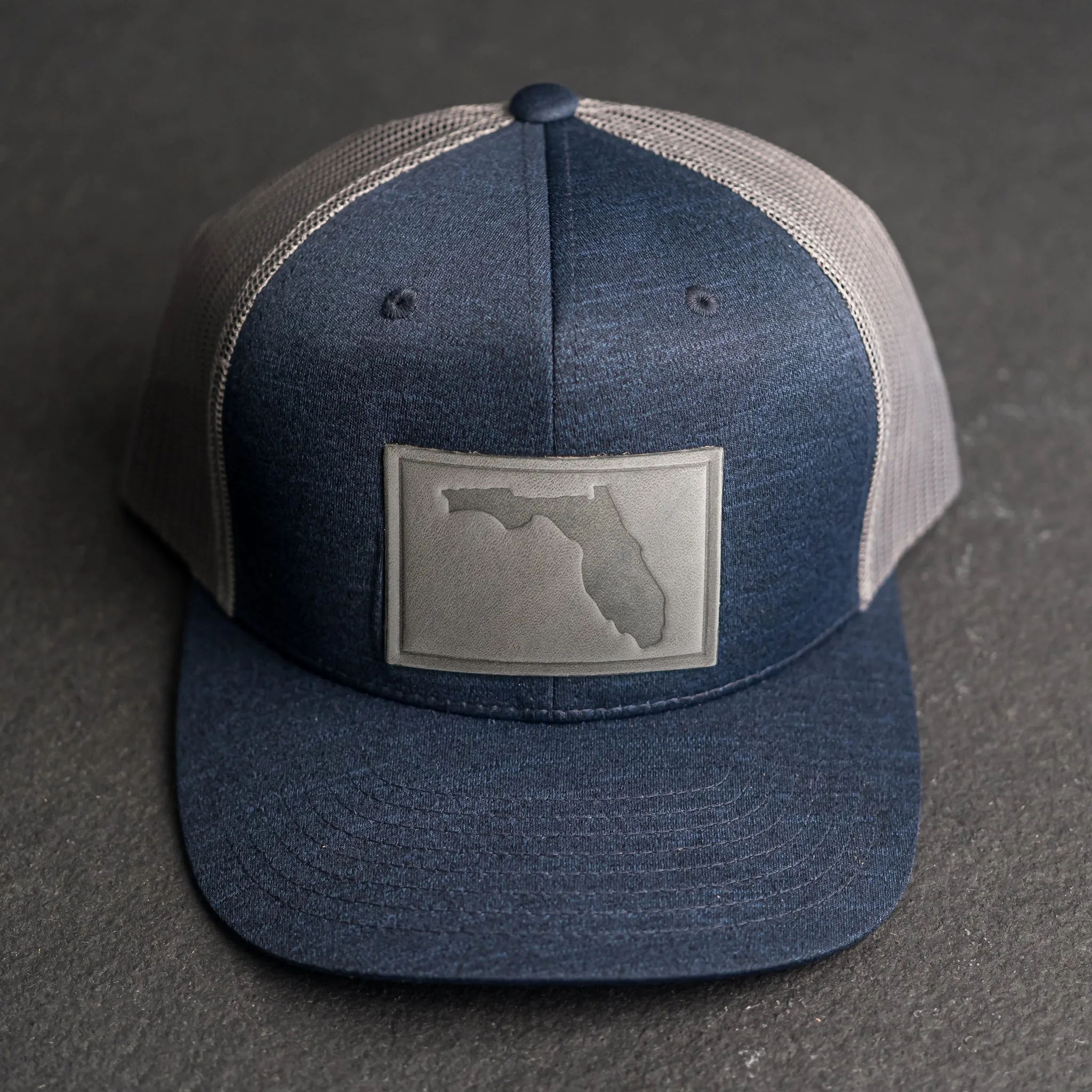 Leather Patch Performance Style Trucker Hat - Florida Stamp