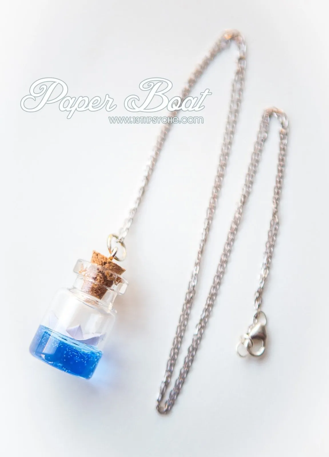 Sterling silver paper boat bottle necklace